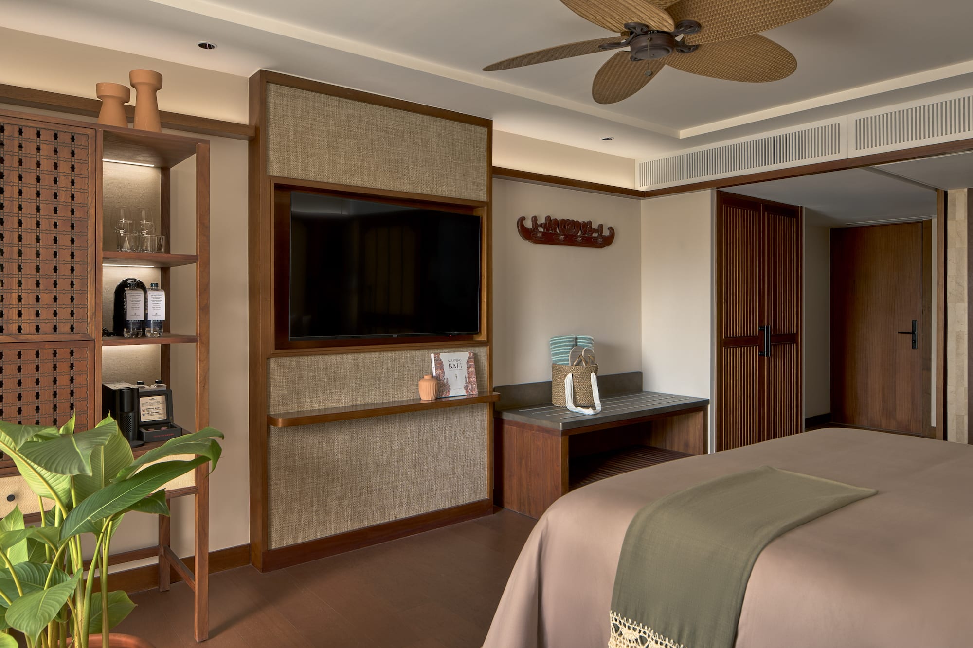 a room with a bed and a tv