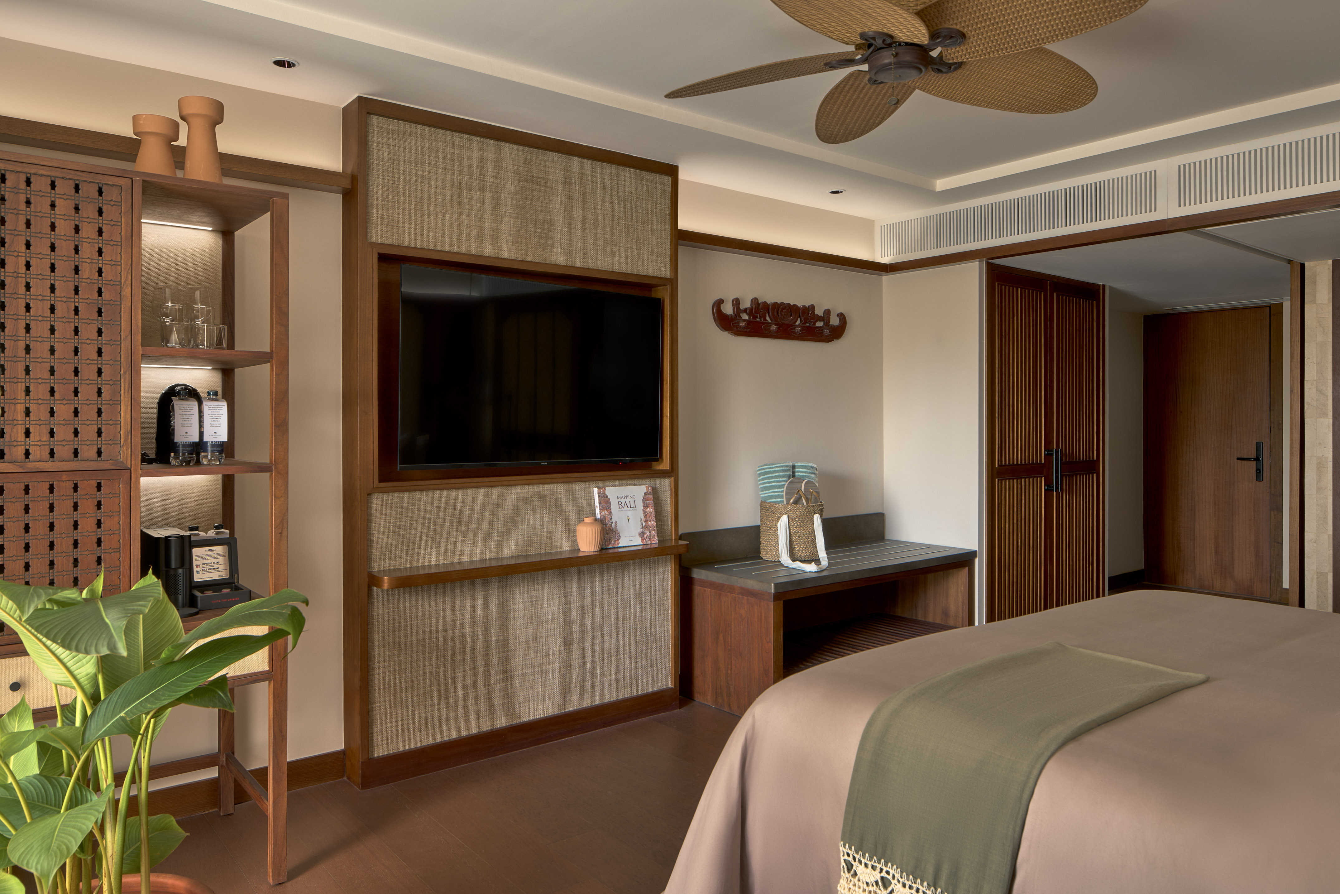 a room with a bed and a tv