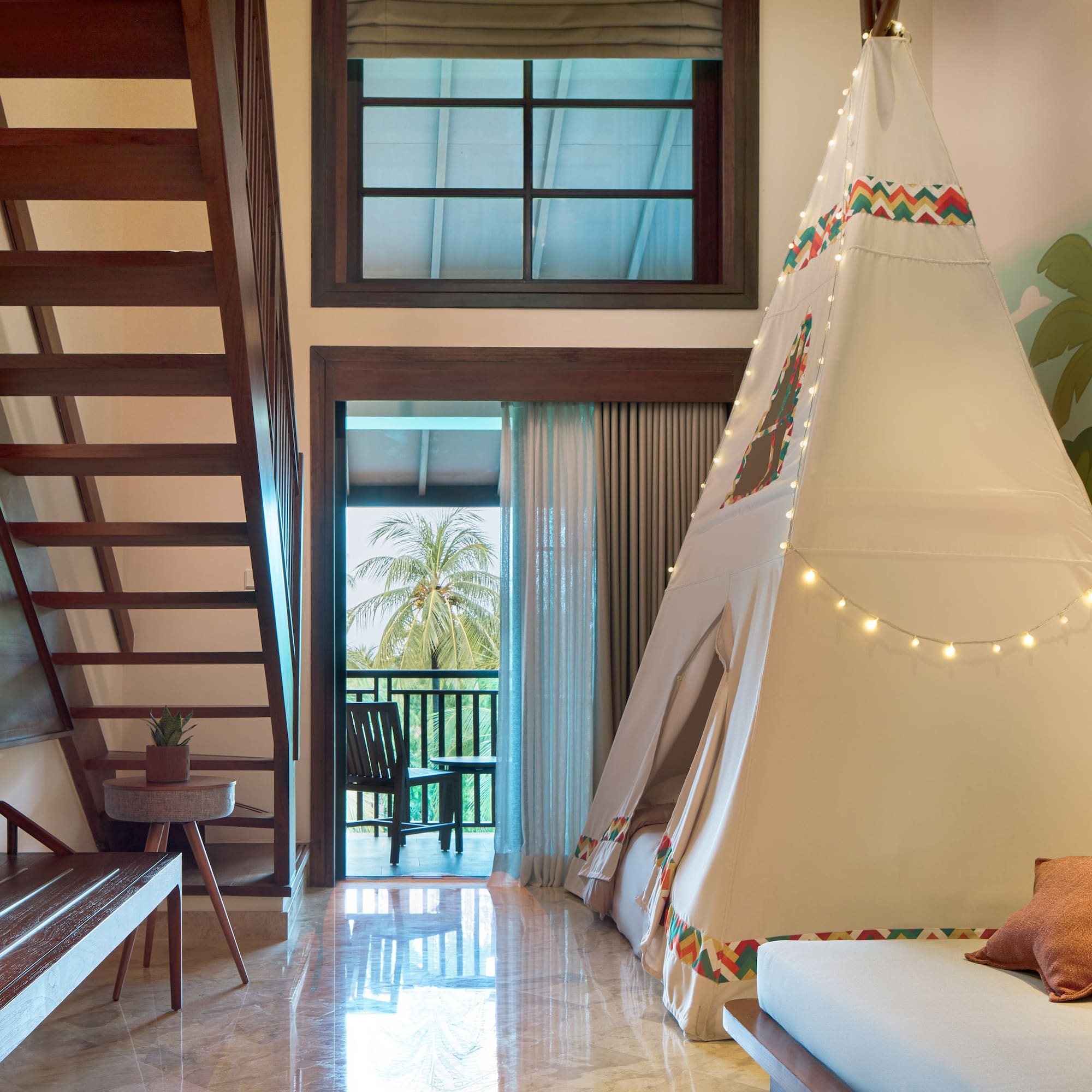 a room with a teepee and a bed