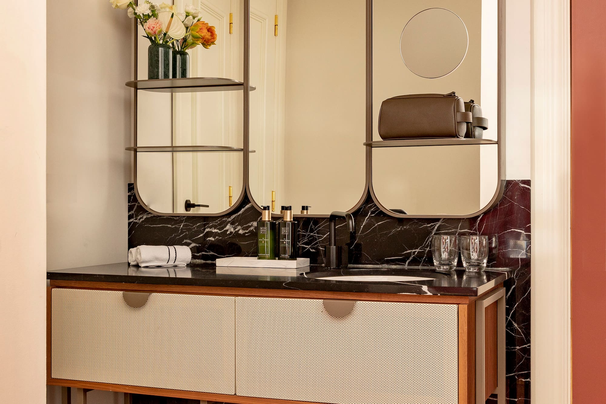 a bathroom with a mirror and a sink