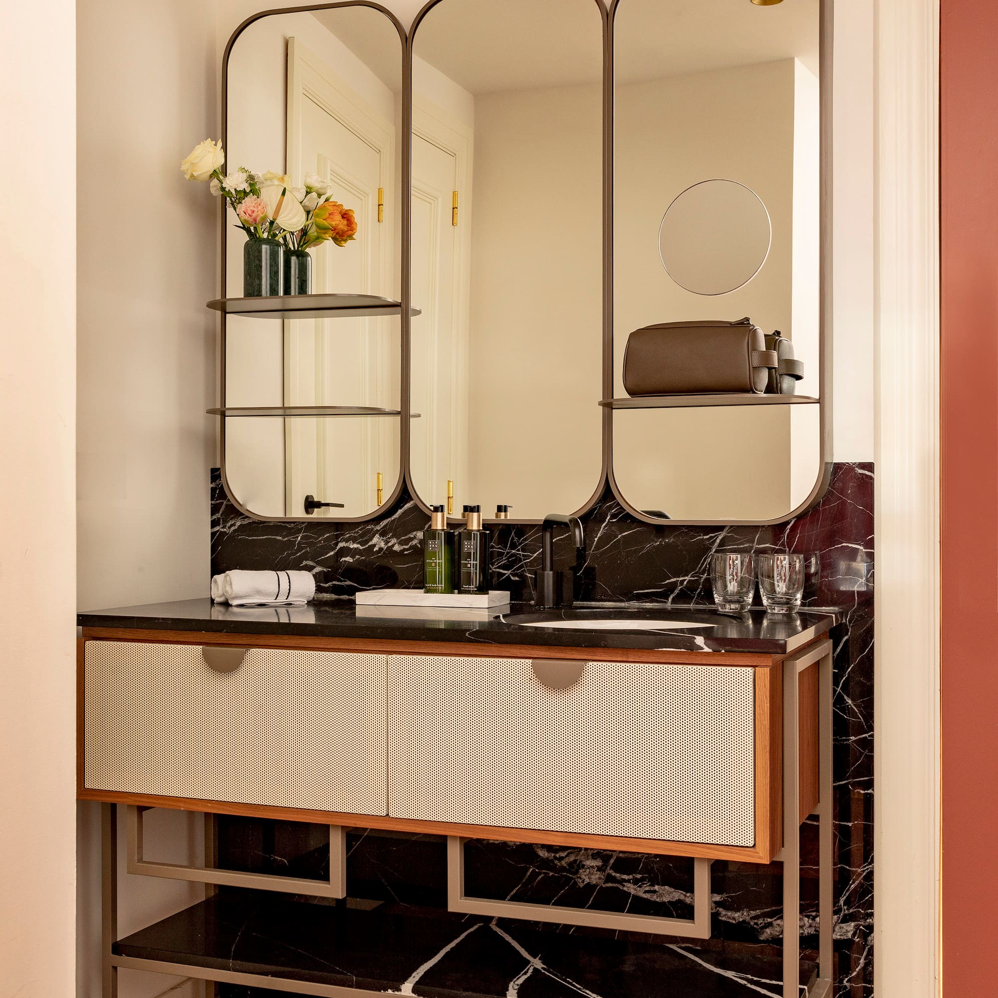 a bathroom with a mirror and a sink