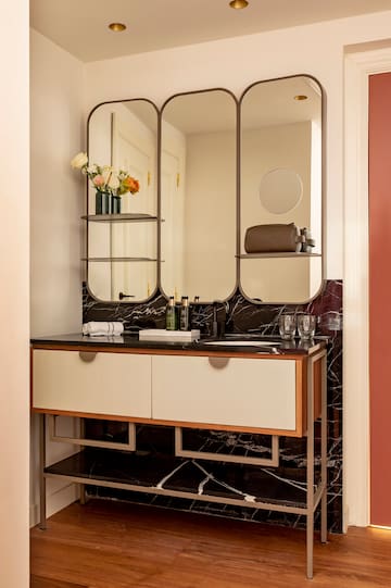 a bathroom with a mirror and a sink