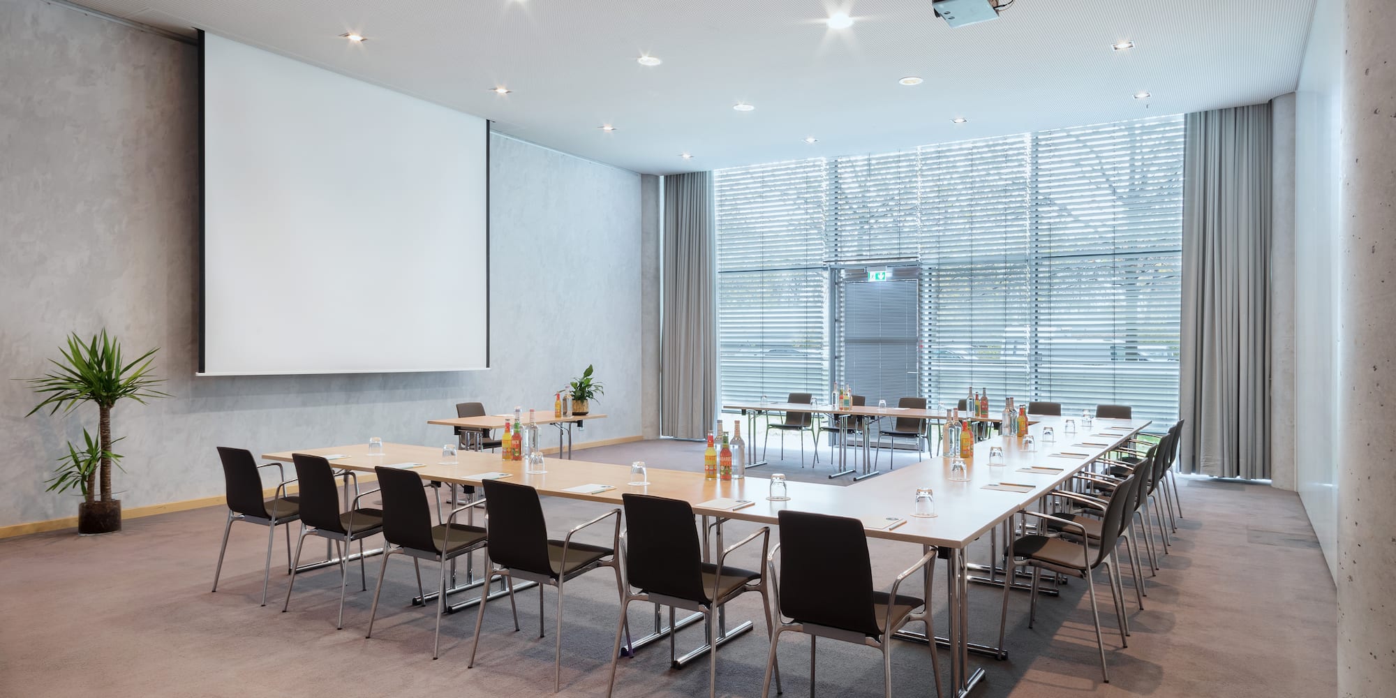 a room with a large table and chairs