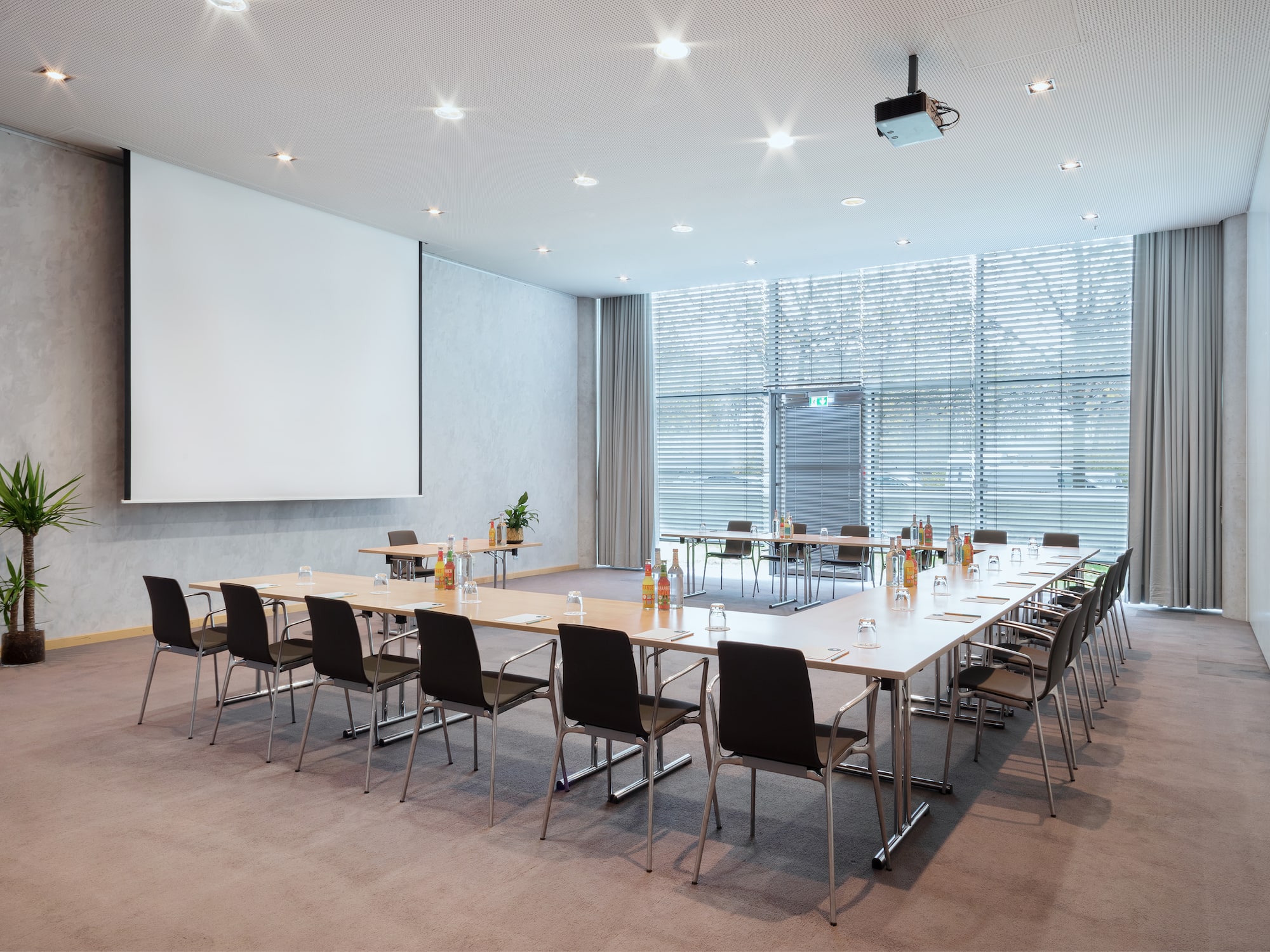 a room with a large table and chairs