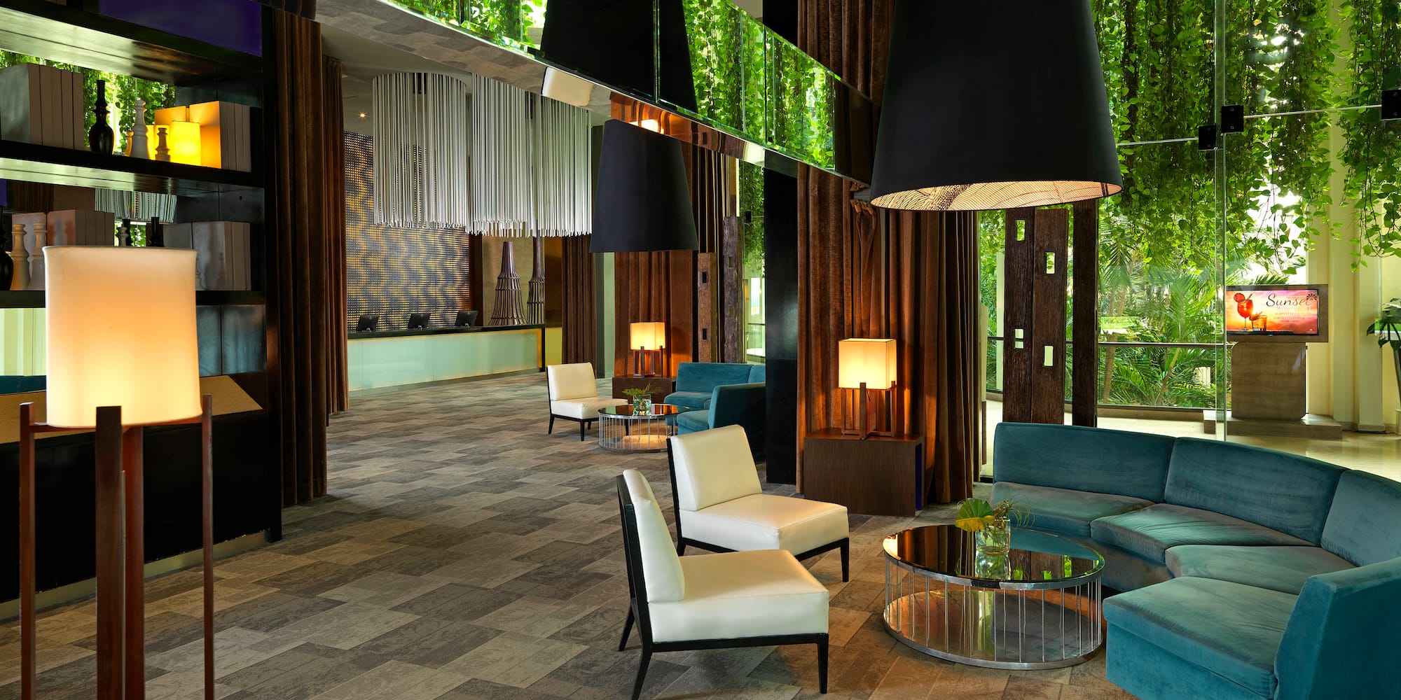 a room with a couch and chairs