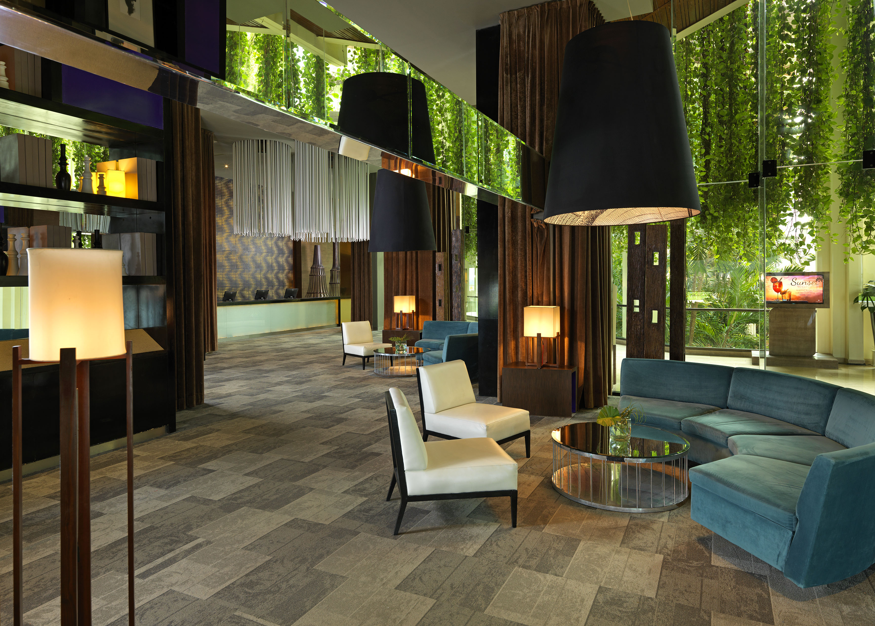 a room with a couch and chairs