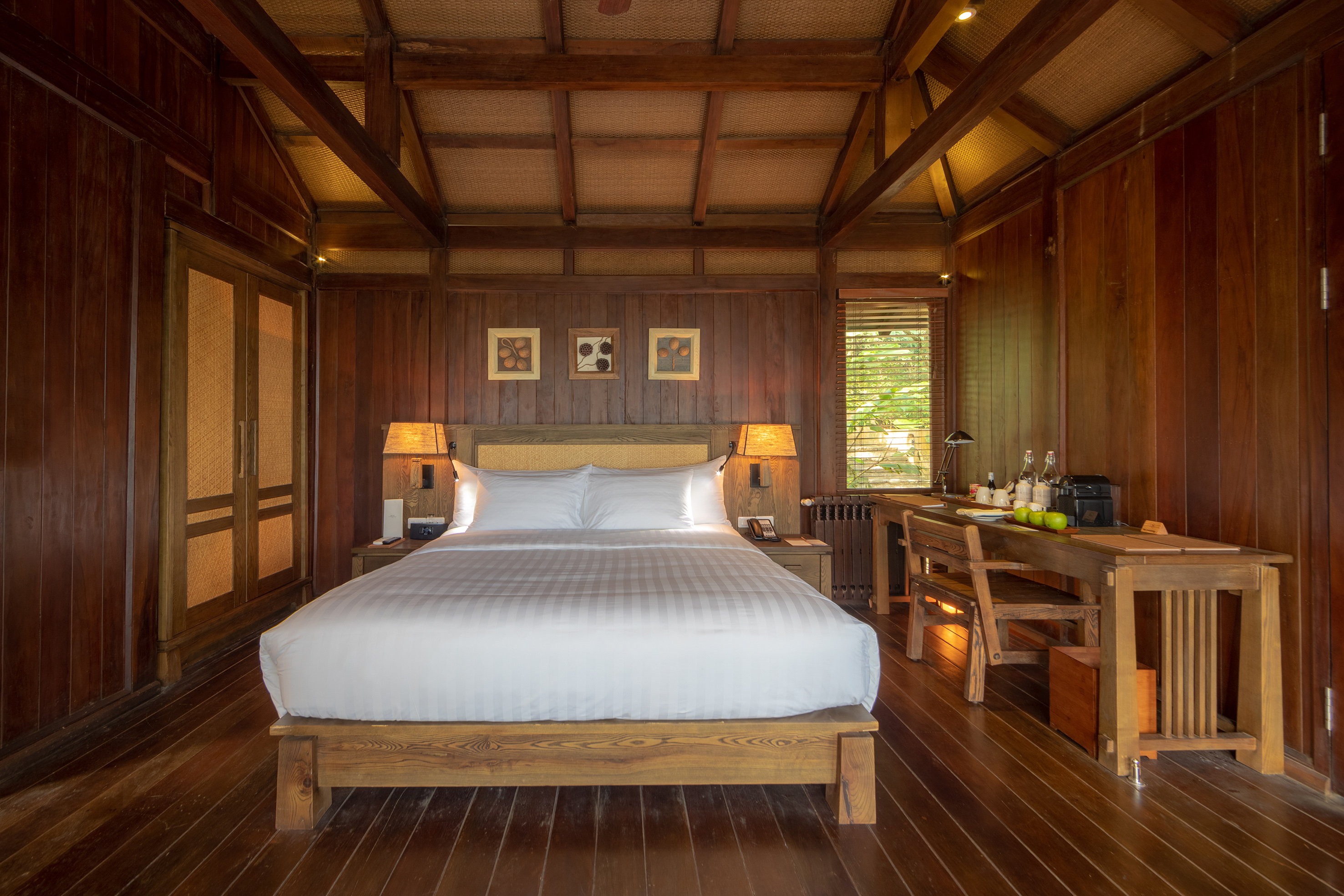 a room with a bed and a desk