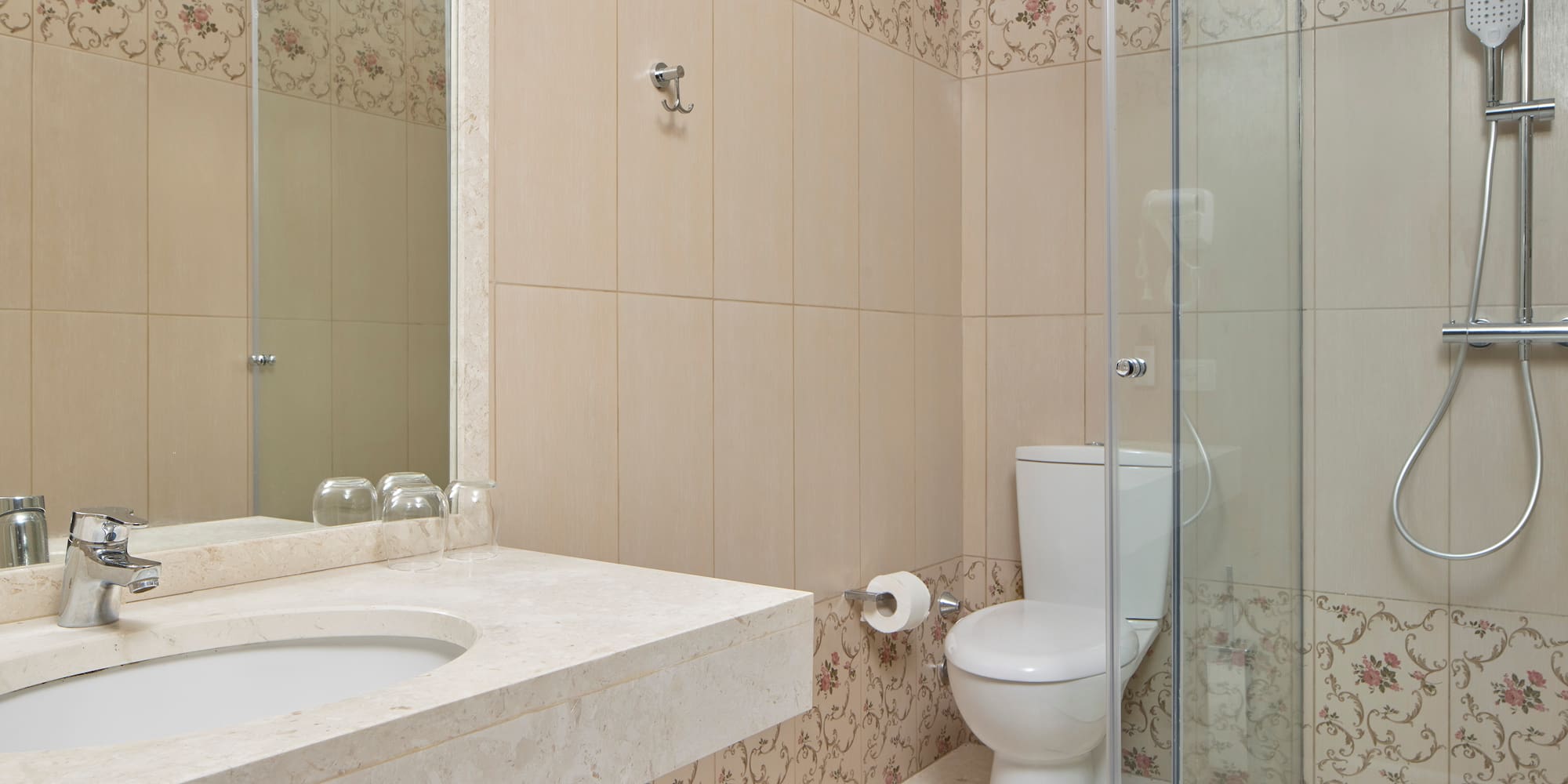 a bathroom with a shower and toilet