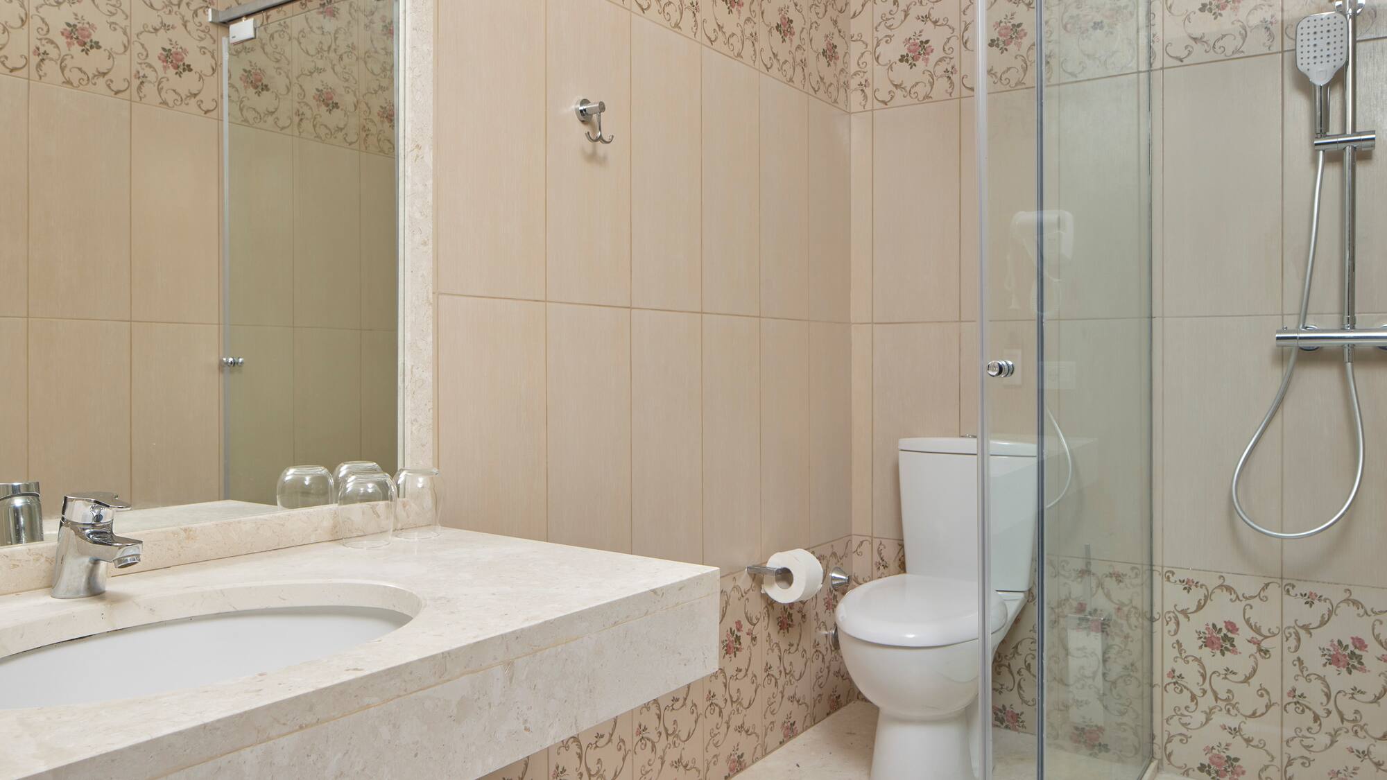 a bathroom with a shower and toilet