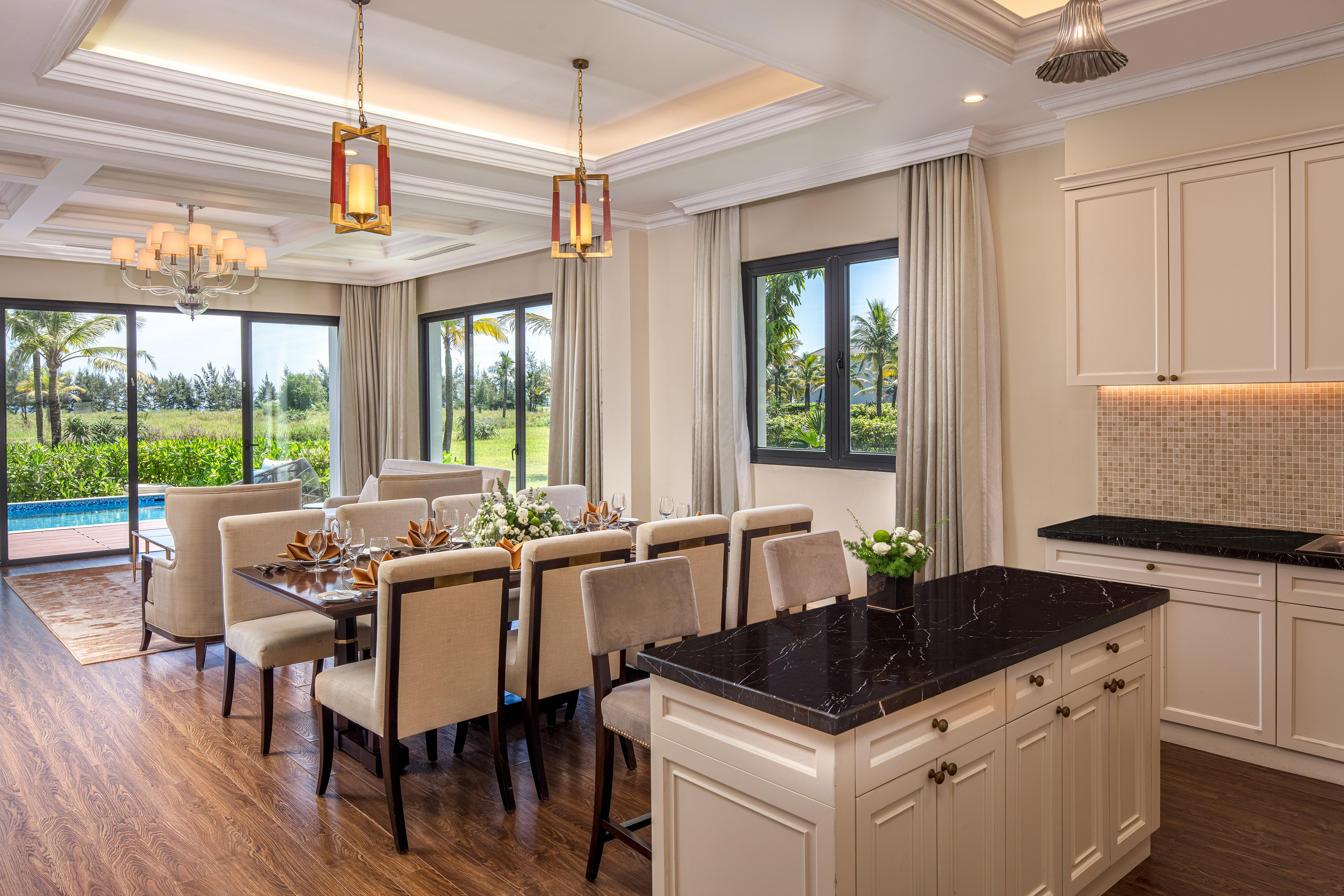 a dining room with a table and chairs
