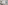 Modern hotel bathroom with vessel sink, vanity, bathtub, and urban window view.