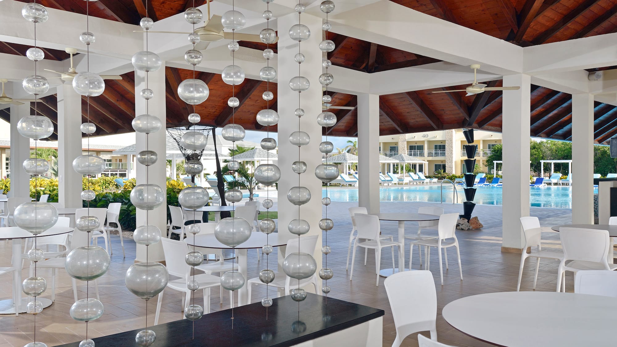 a pool with a swimming pool and a pool in the background