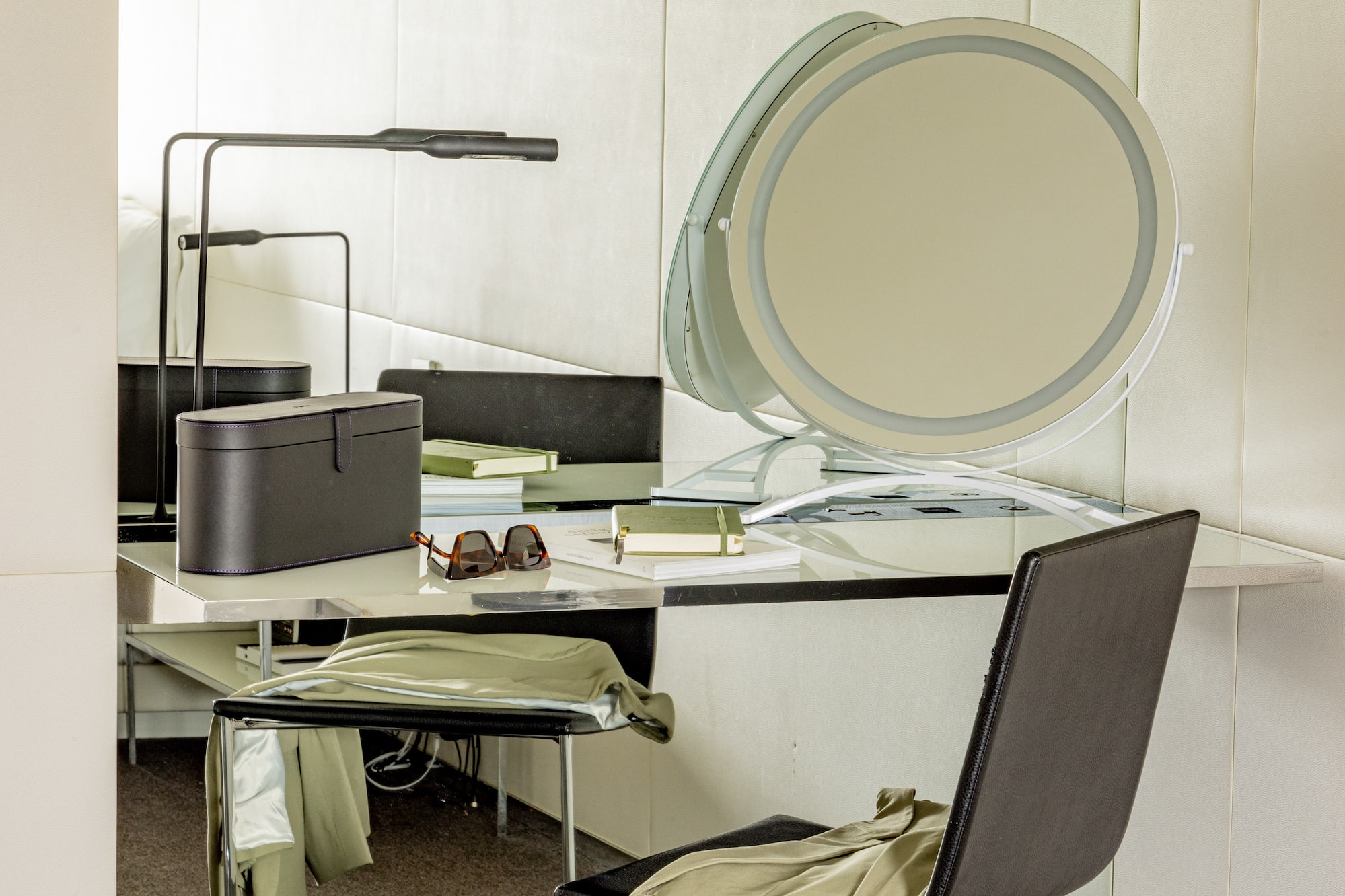 a chair and a desk with a mirror