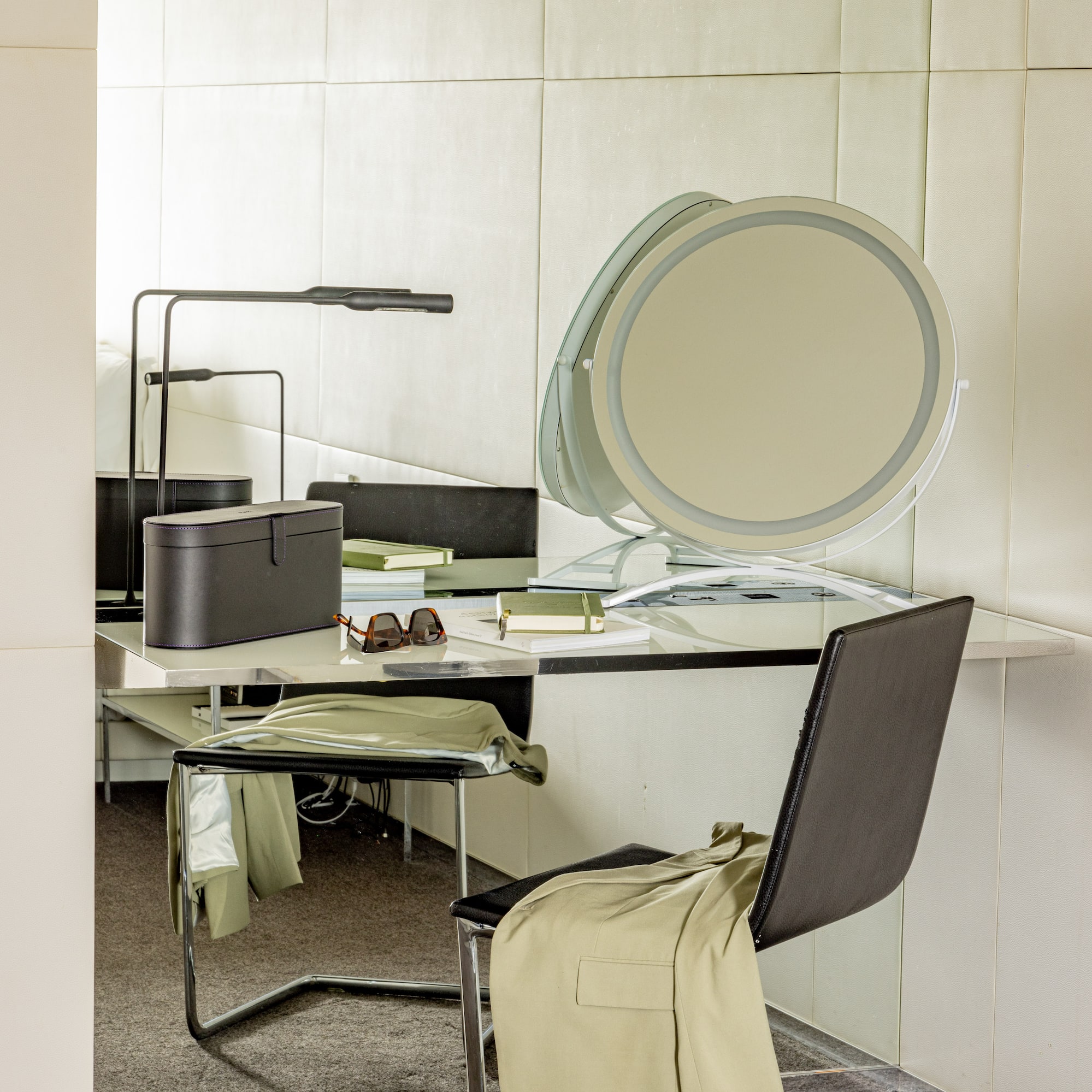 a chair and a desk with a mirror