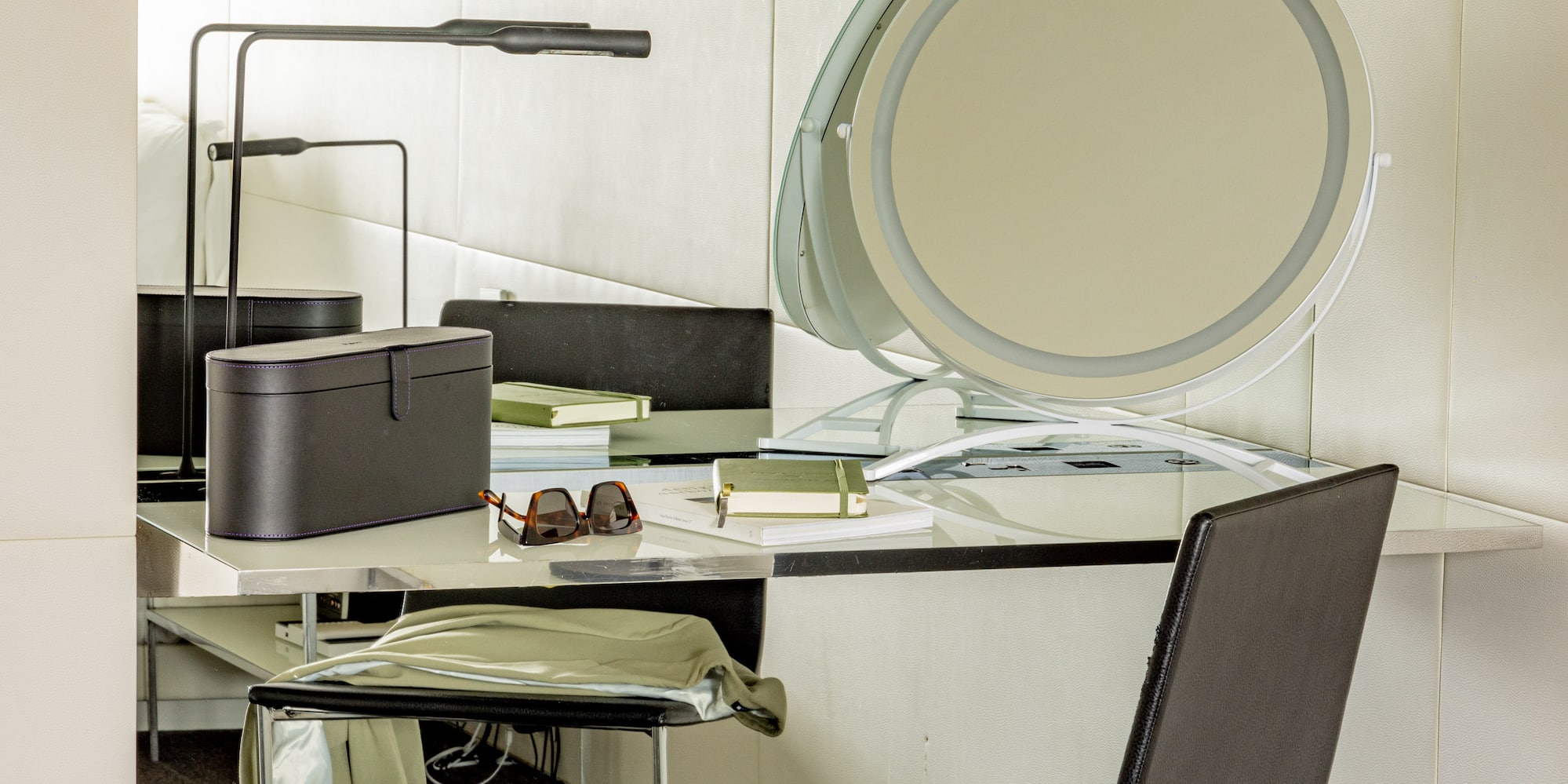 a chair and a desk with a mirror