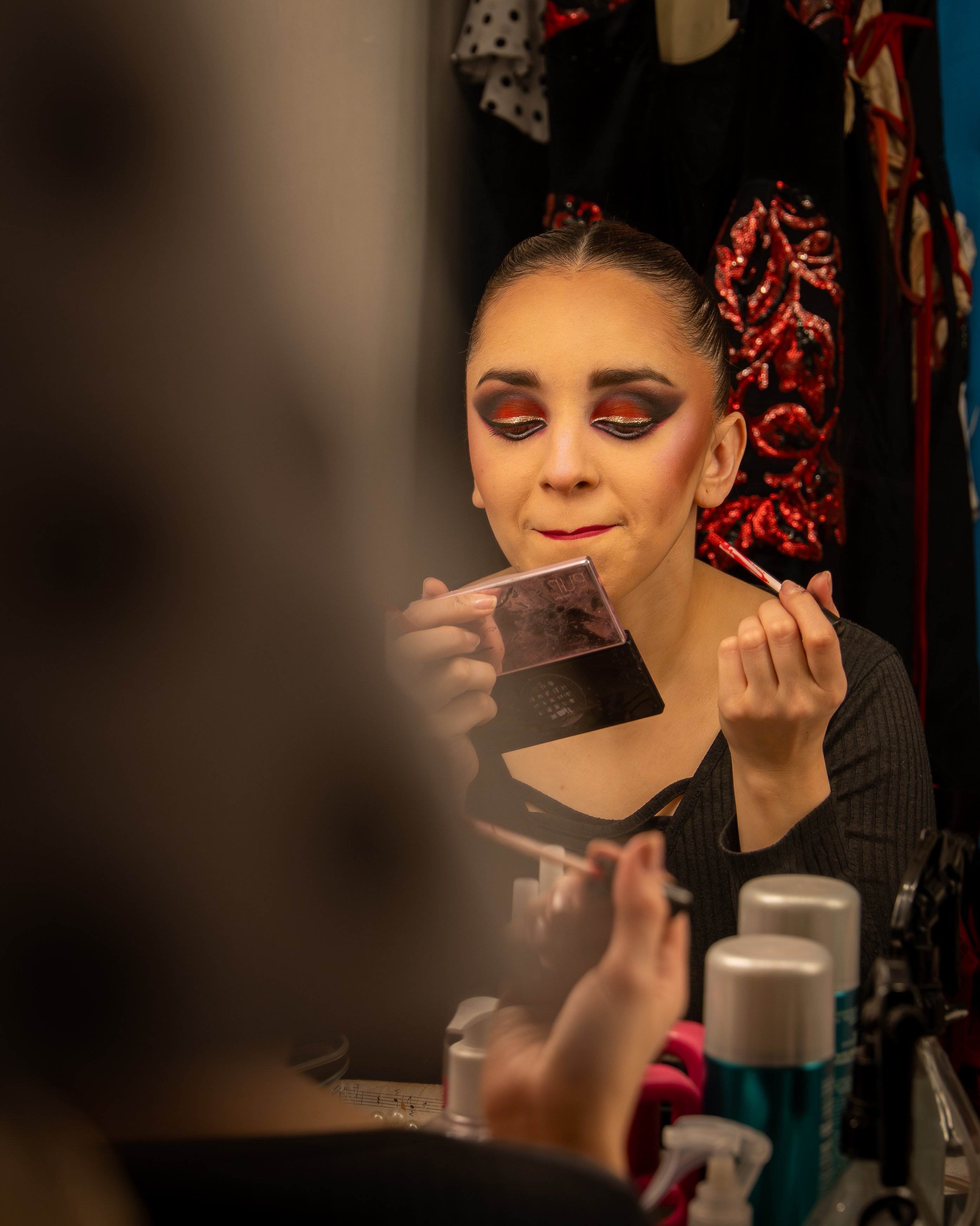 a woman putting on makeup