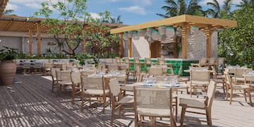 a patio with tables and chairs