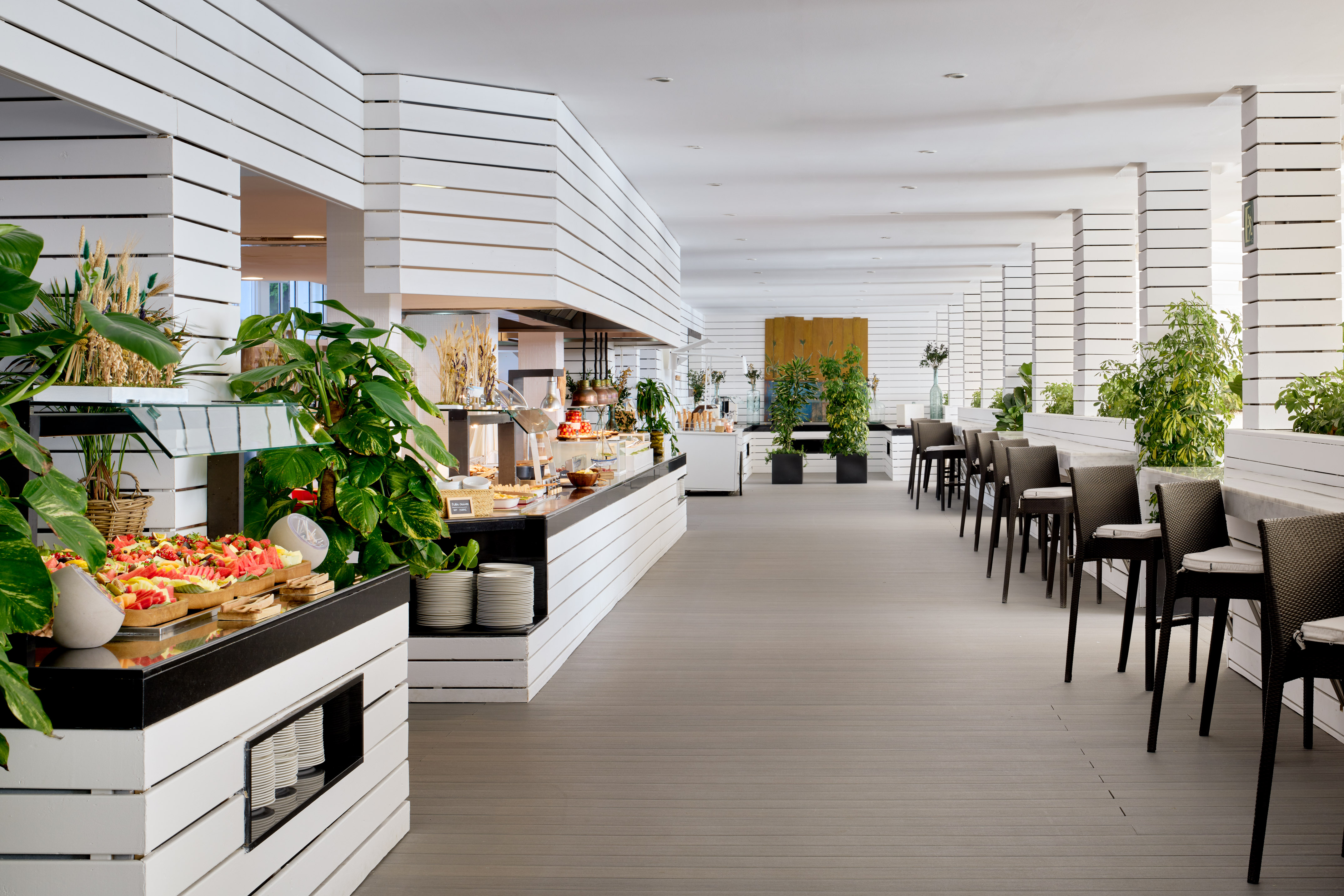 Modern resort buffet restaurant with fresh food display and spacious dining.