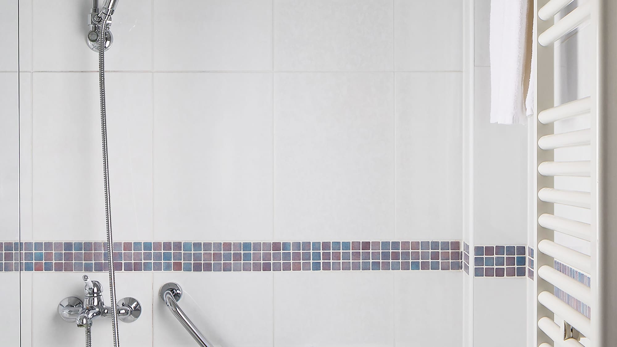 a bathtub and shower in a bathroom