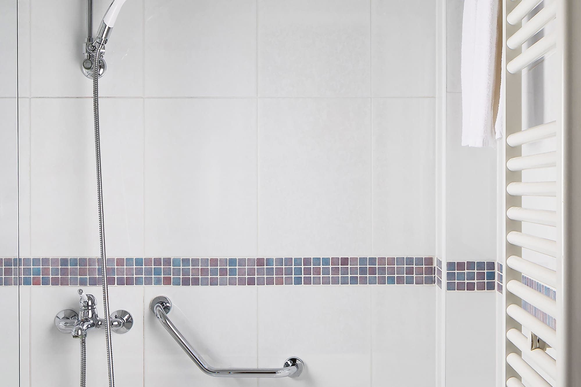 a bathtub and shower in a bathroom