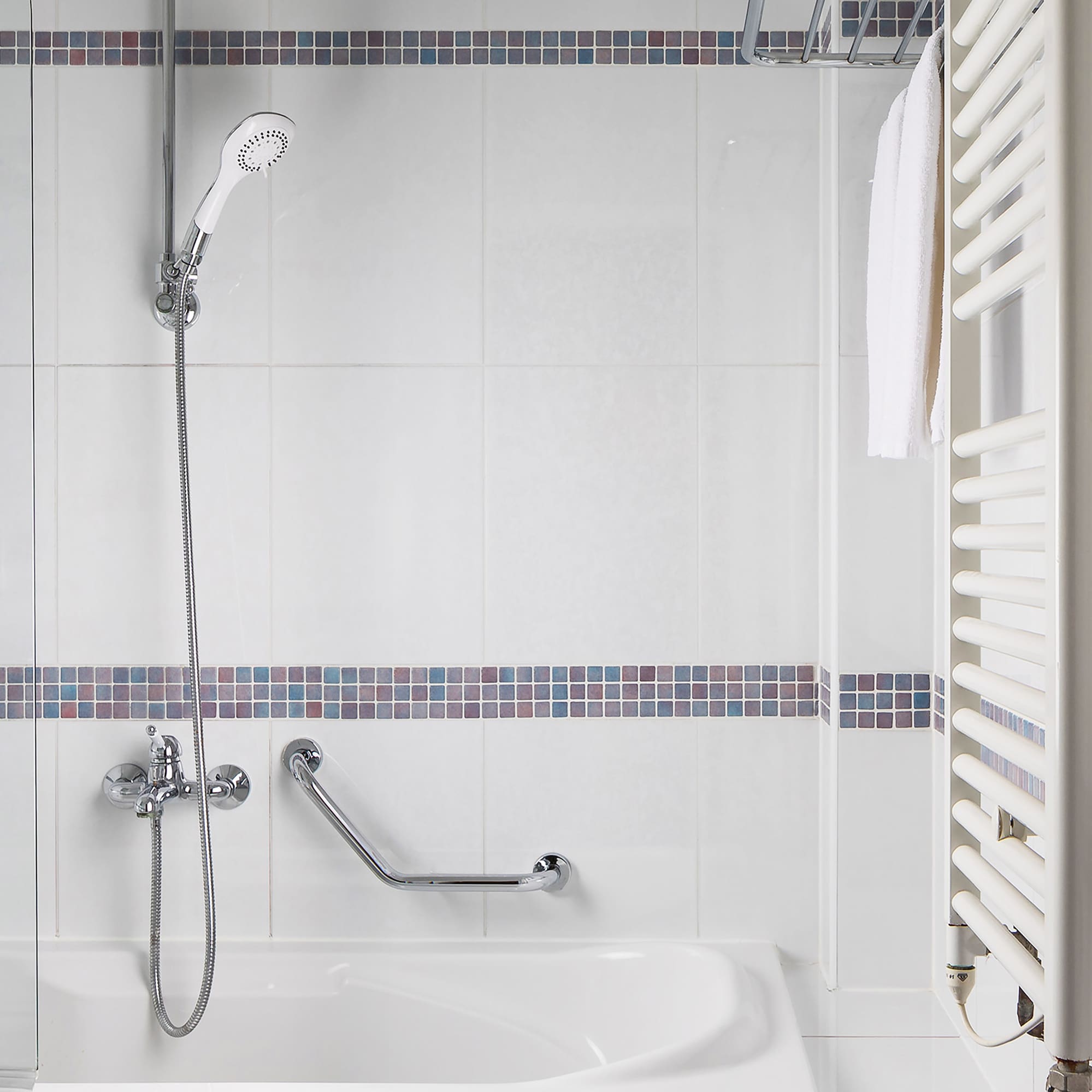 a bathtub and shower in a bathroom
