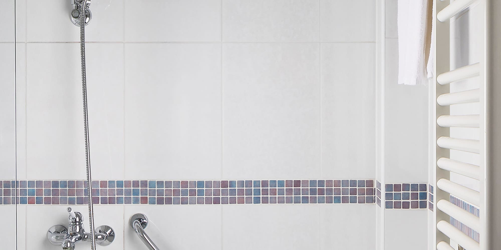 a bathtub and shower in a bathroom