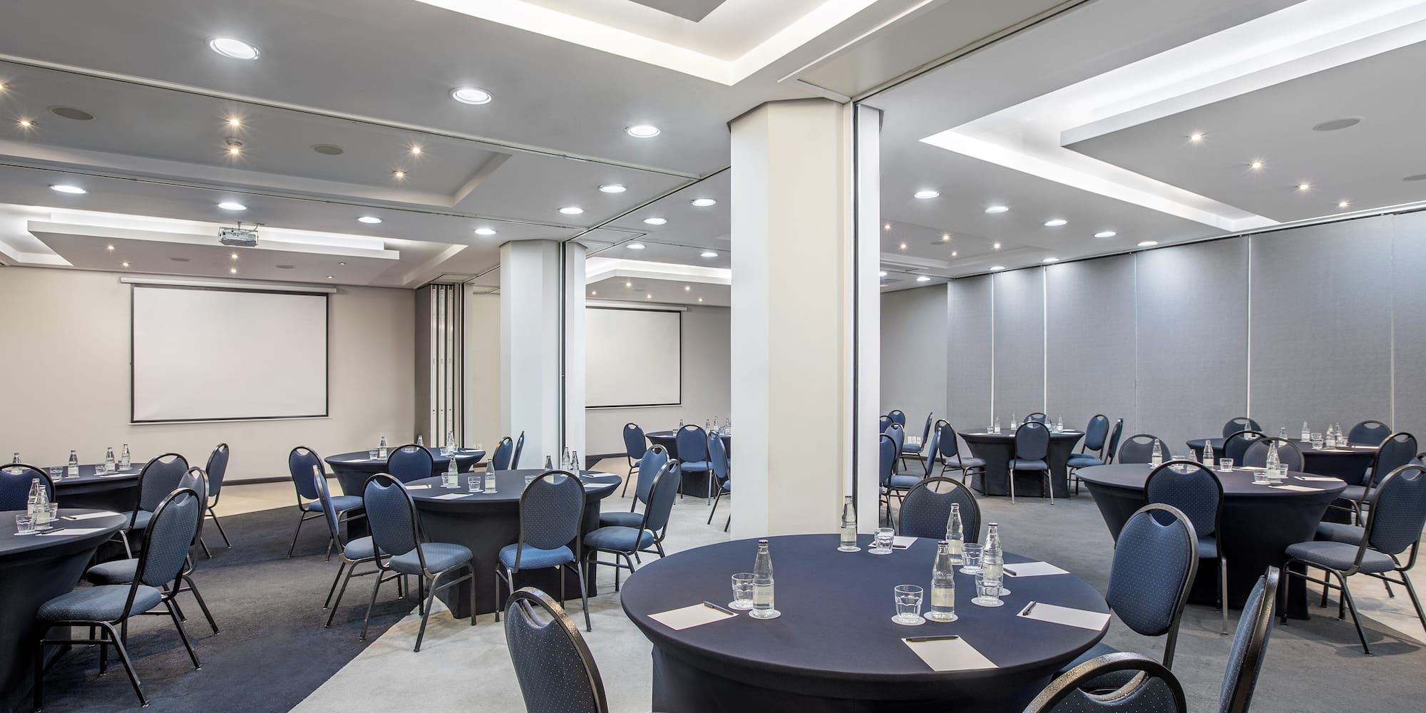 a room with round tables and chairs