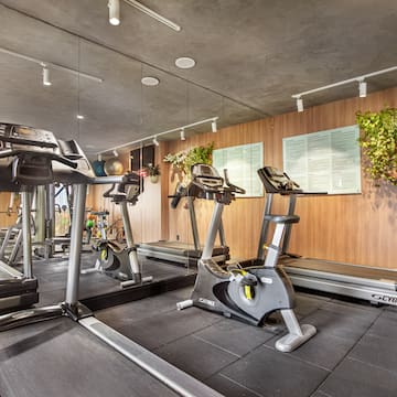 a gym with treadmills and exercise machines