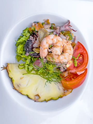 a plate of food on a white surface
