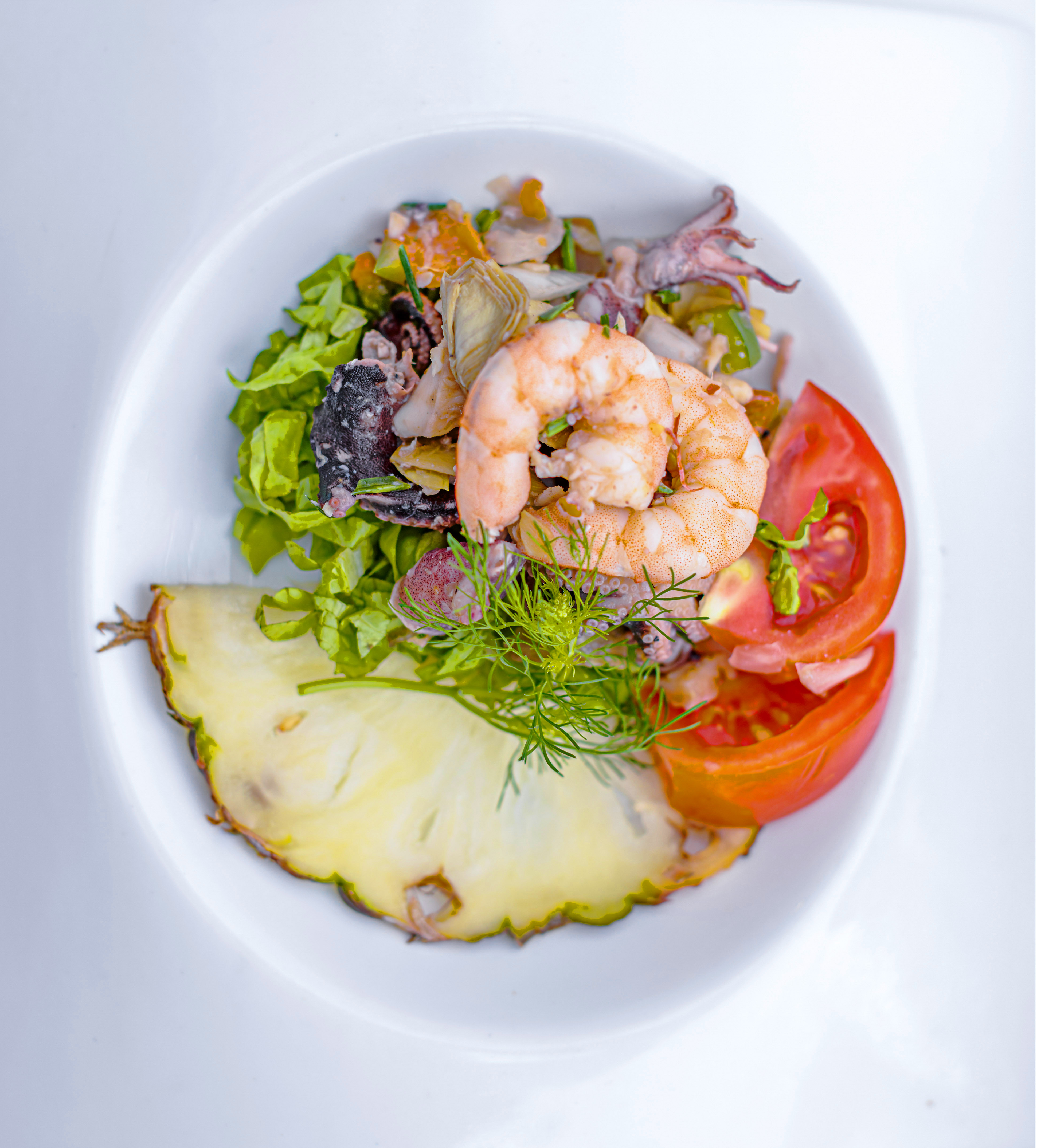 a plate of food on a white surface
