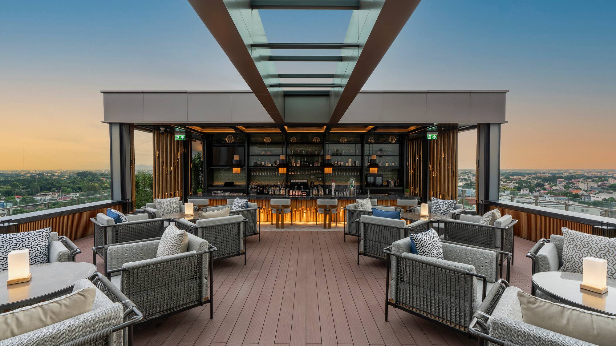 a patio with chairs and a bar