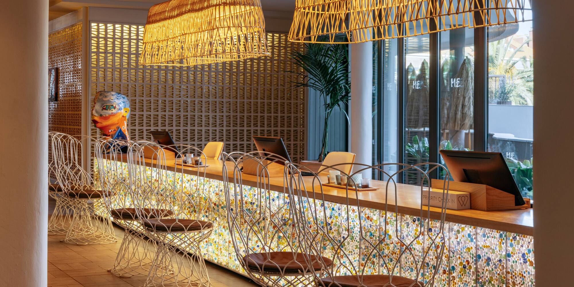 a room with a bar and chairs