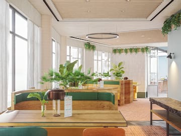 a room with green and white furniture