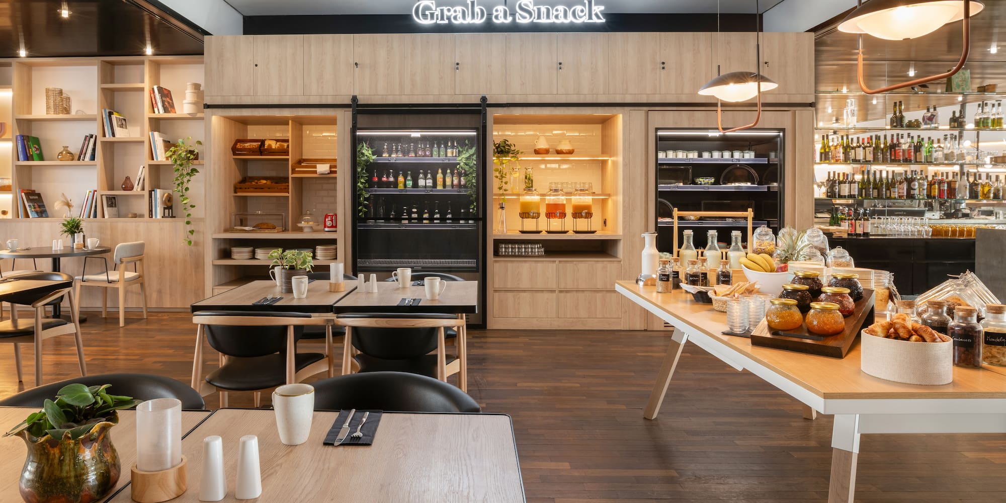 a restaurant with a buffet table and chairs