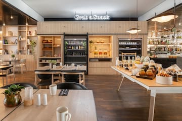 a restaurant with a buffet table and chairs
