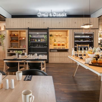 a restaurant with a buffet table and chairs