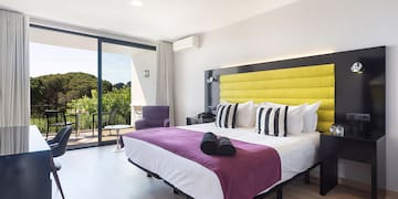 a room with a bed and a glass door