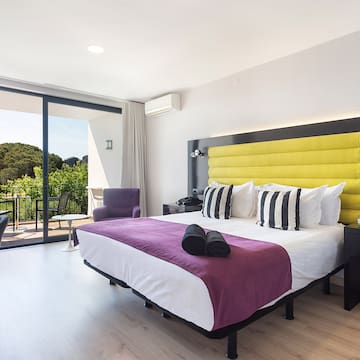 a room with a bed and a glass door