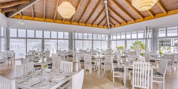 a room with tables and chairs