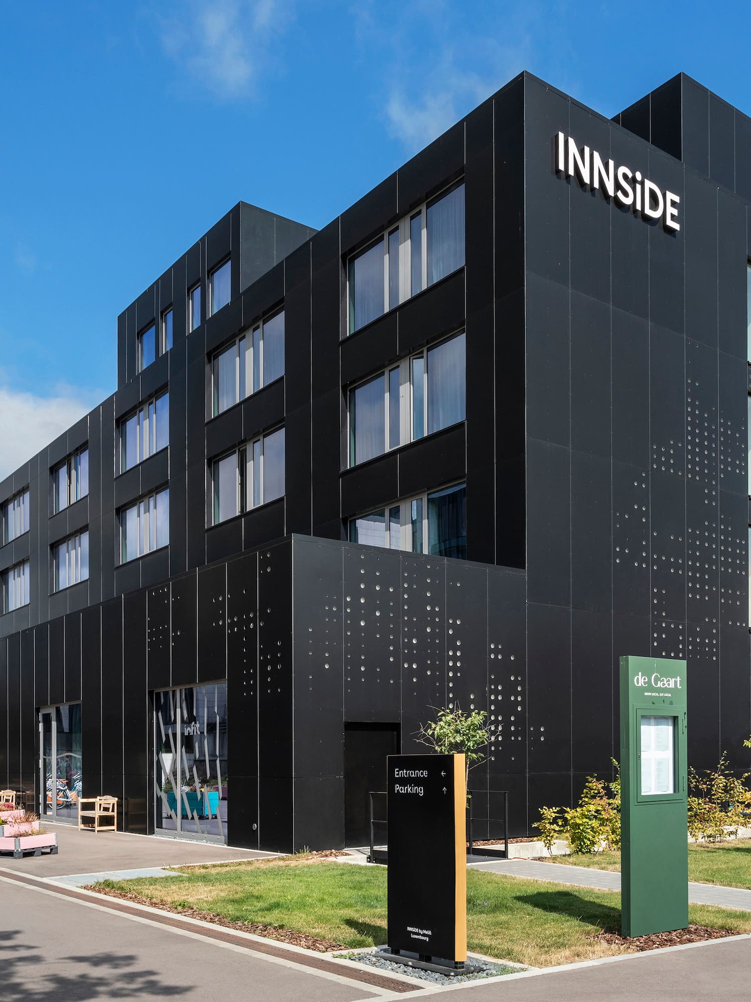 a black building with a sign on it