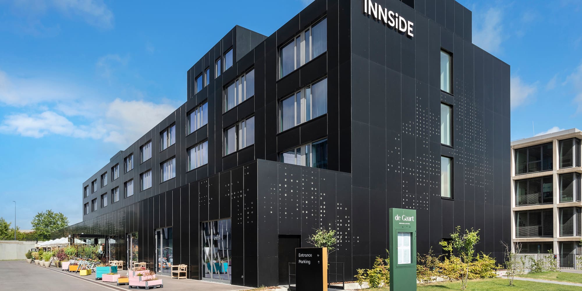 a black building with a sign on it