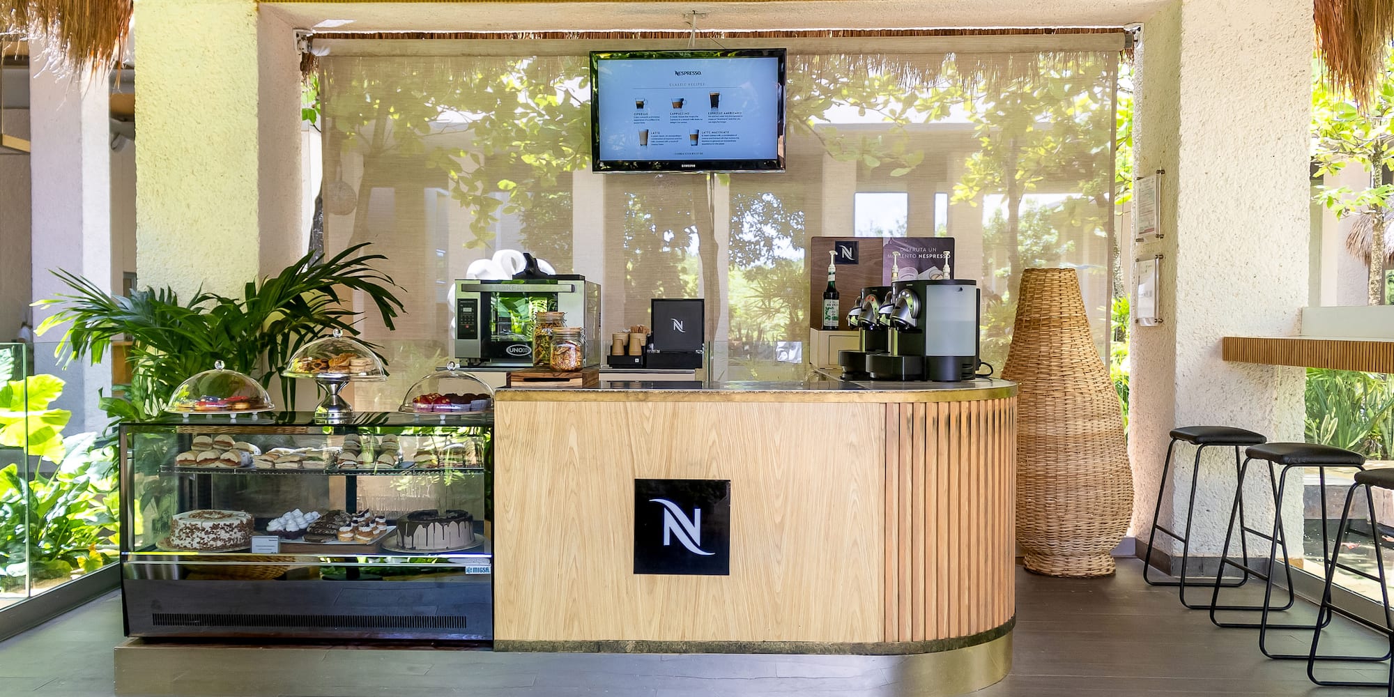 a coffee shop with a screen