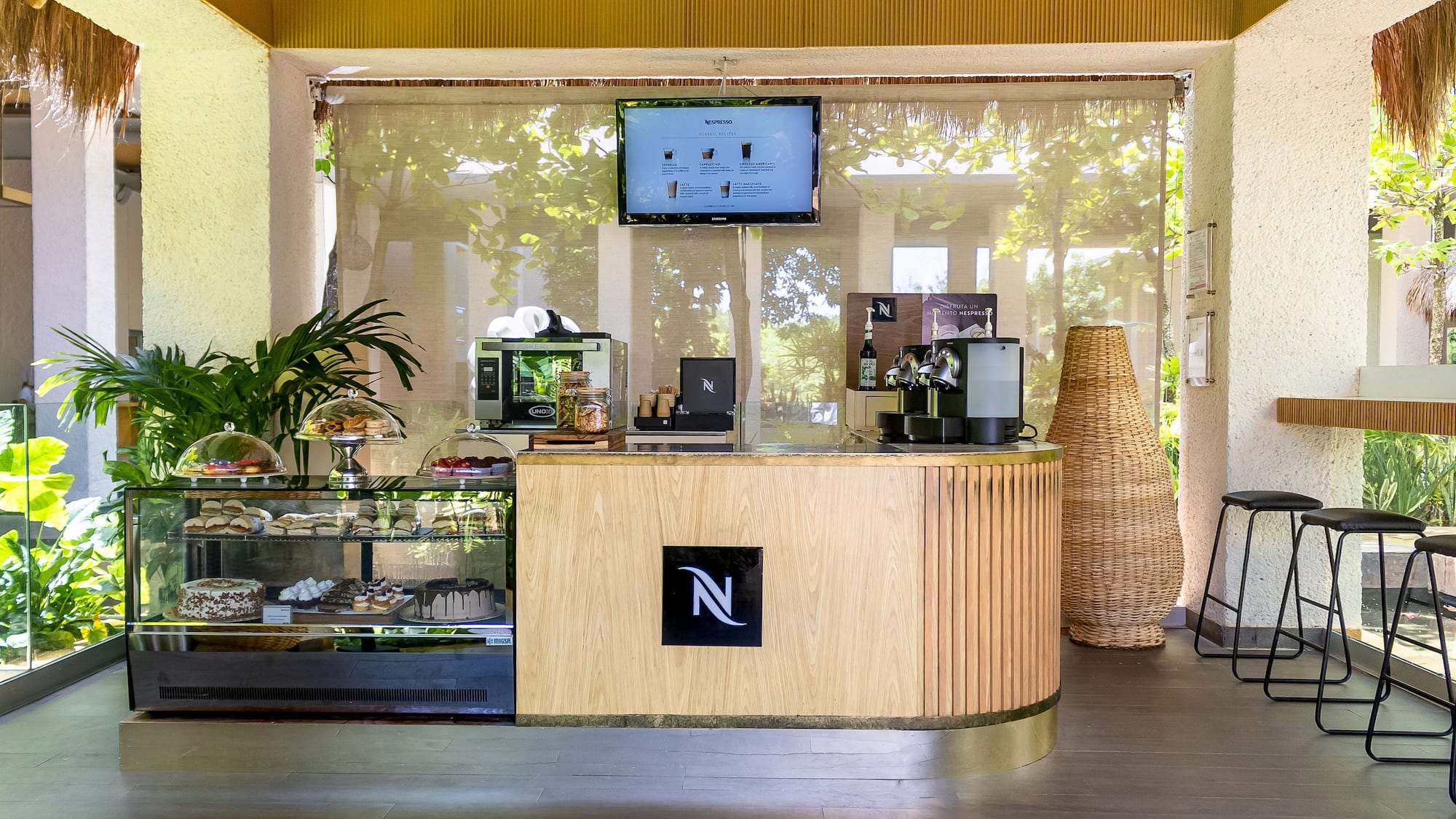 a coffee shop with a screen