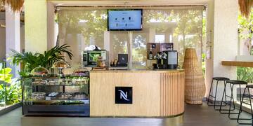 a coffee shop with a screen