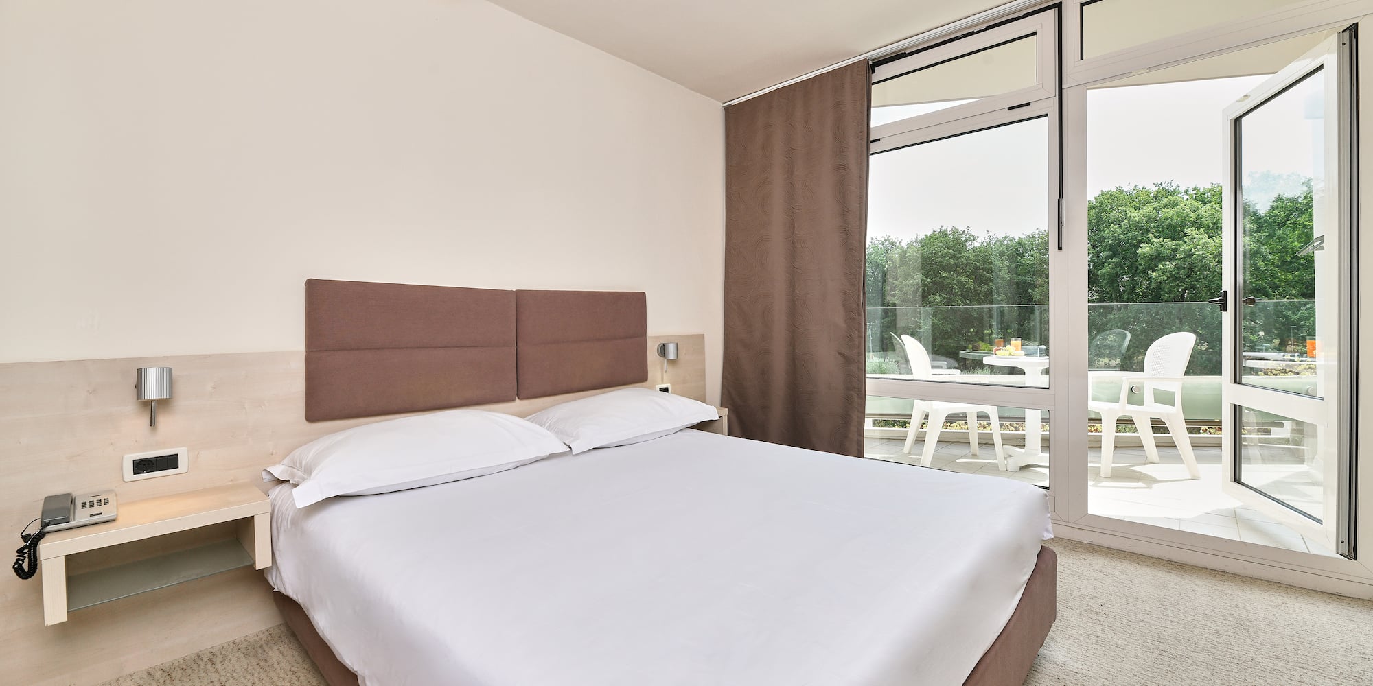 a bed with a glass door