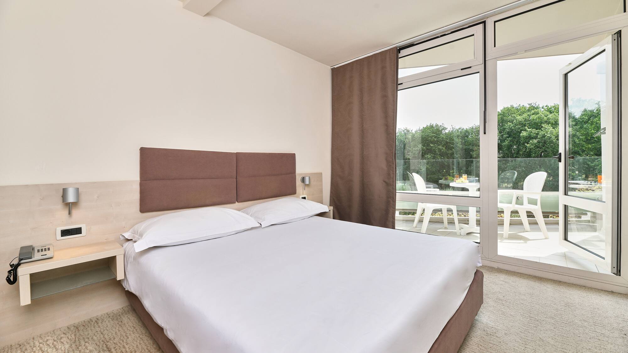 a bed with a glass door