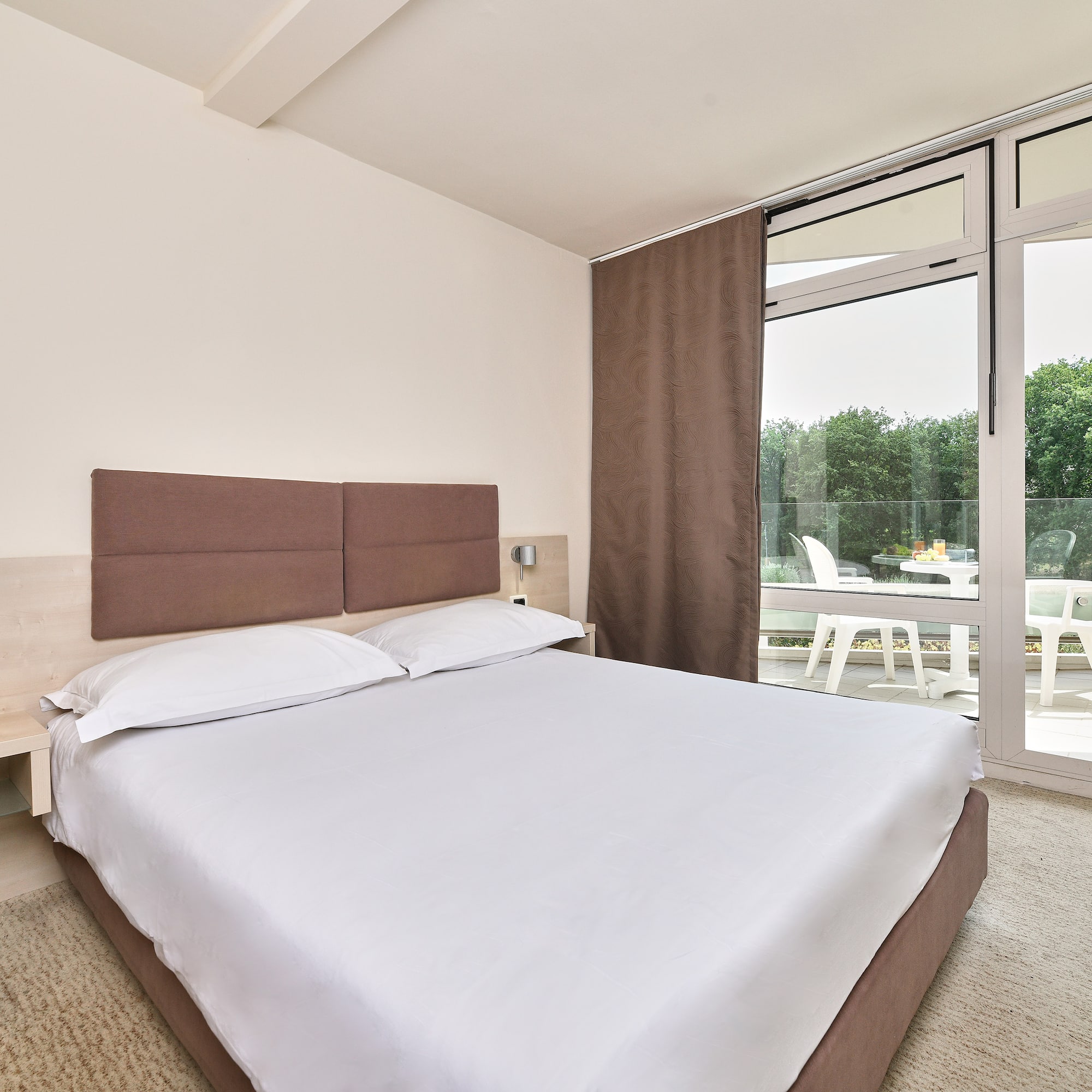 a bed with a glass door