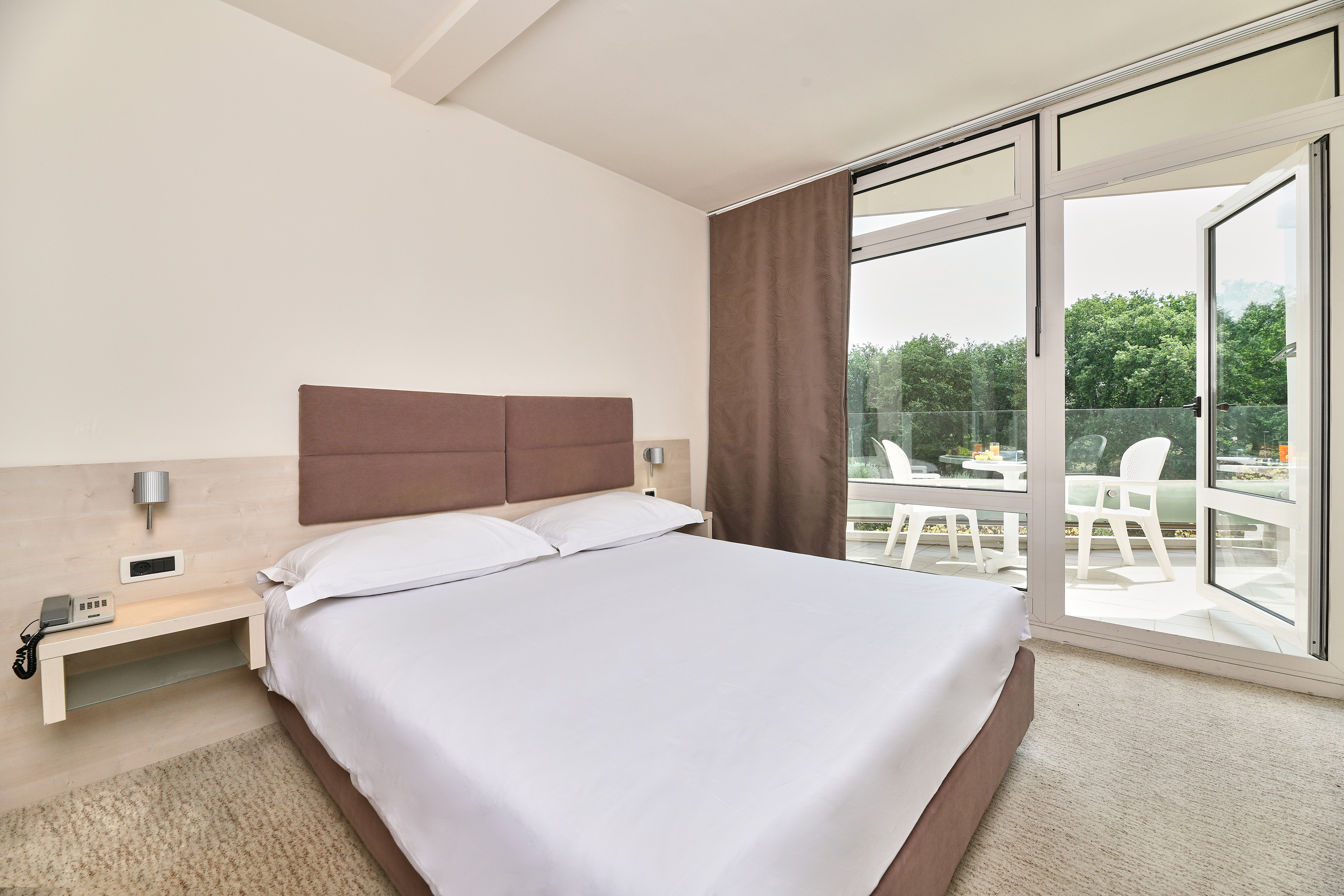 a bed with a glass door