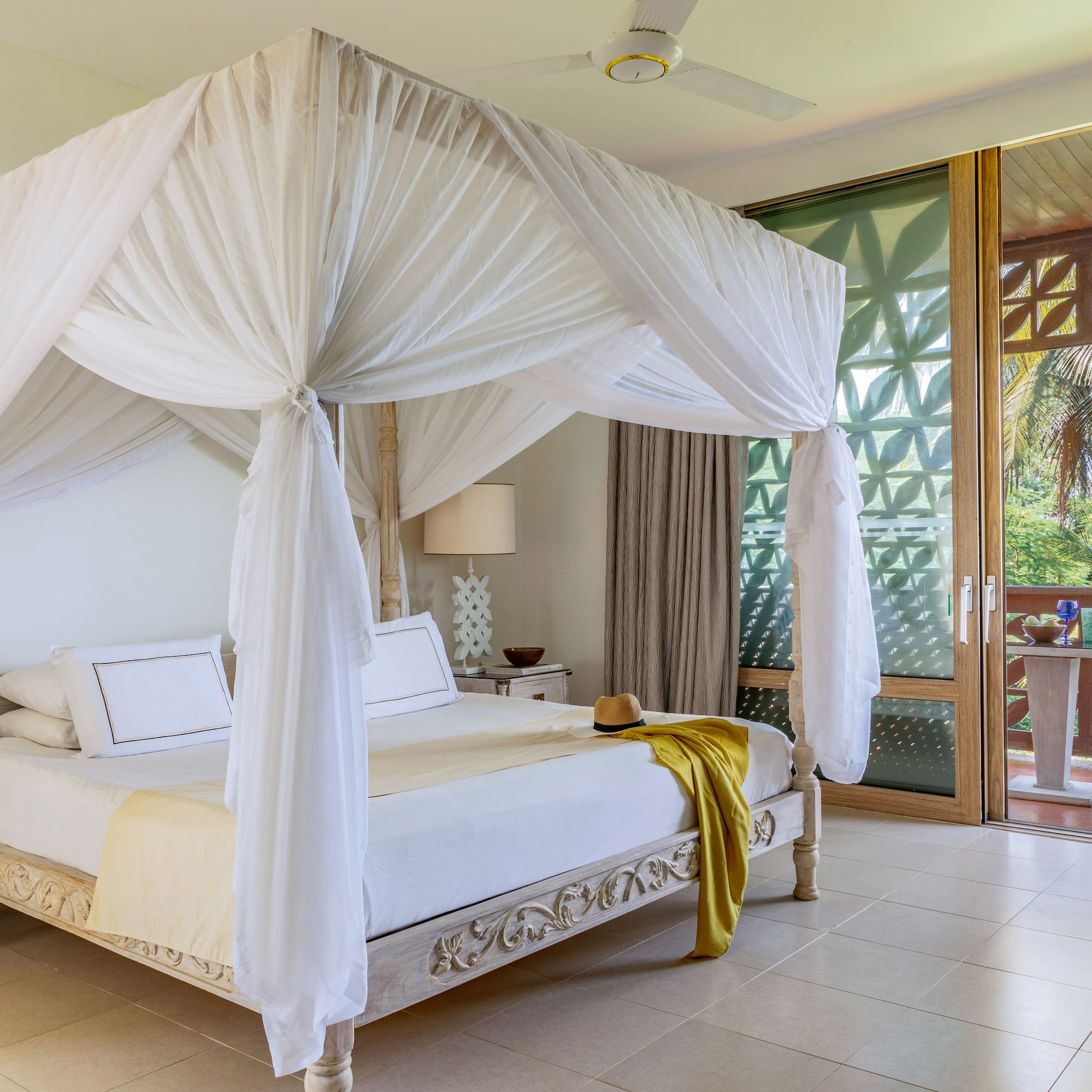 a white canopy bed in a room