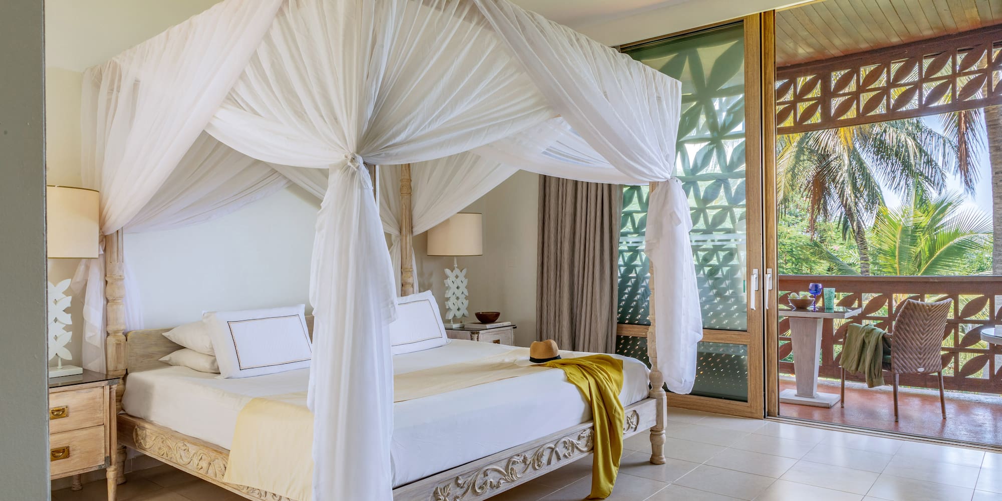 a white canopy bed in a room